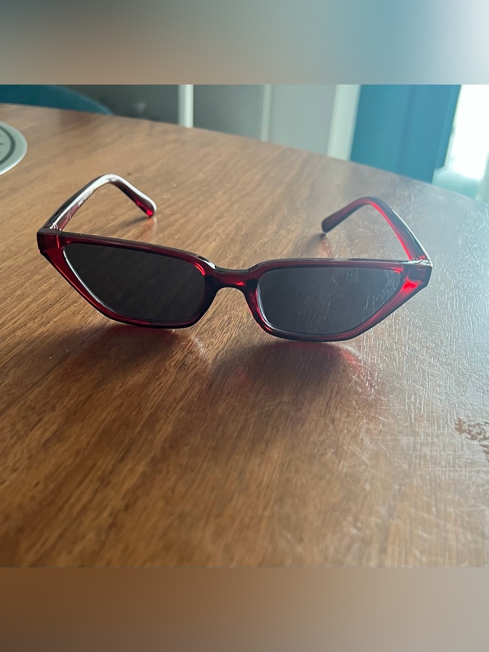 Burgundy red slim retro-style cat-eye sunglasses with dark lens